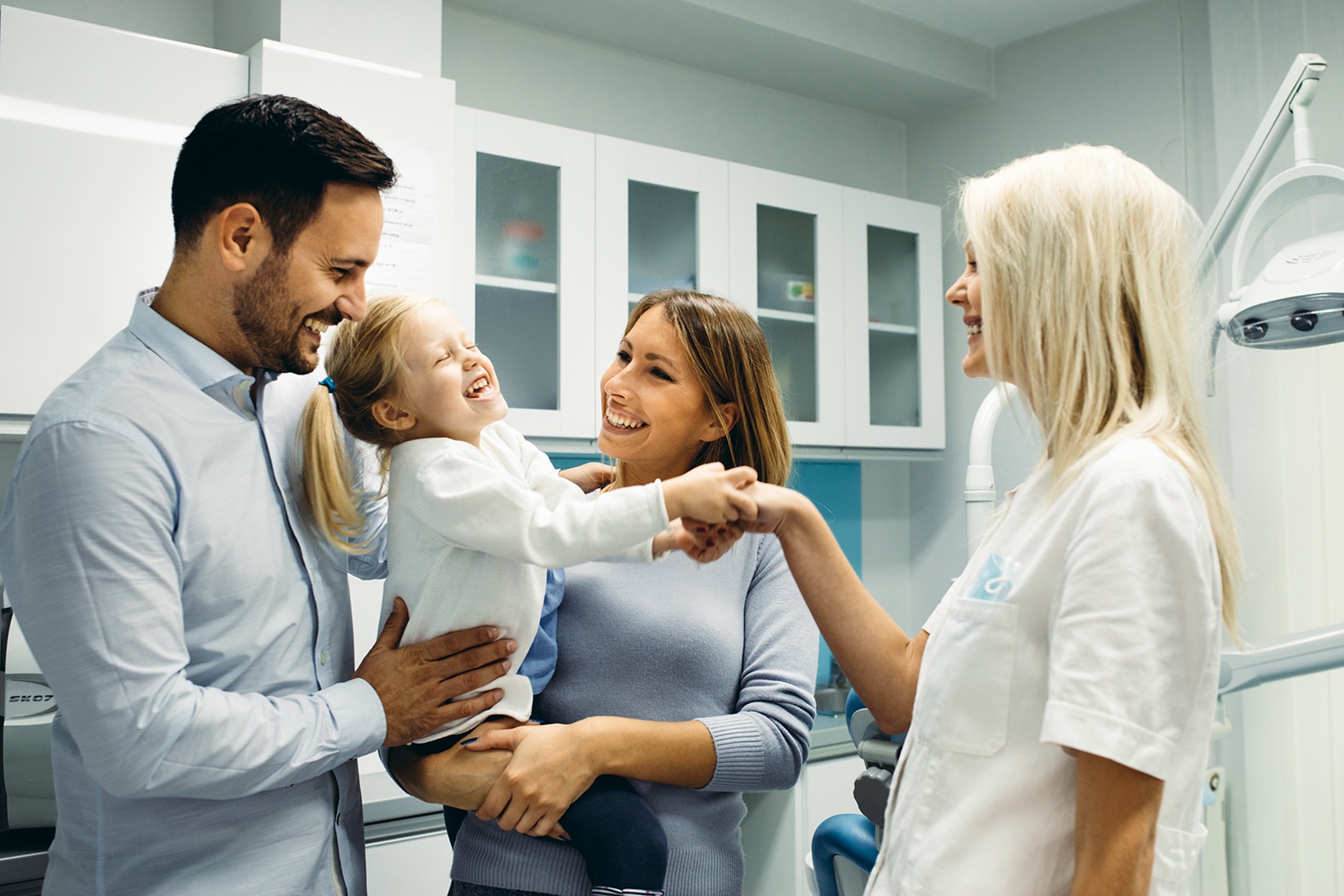 family at dentist after financing pediatric dental care in brooklyn ny
