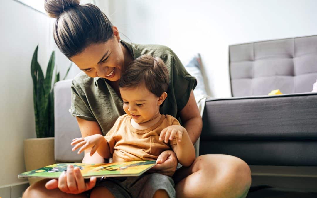 Mom and child in reading a book.