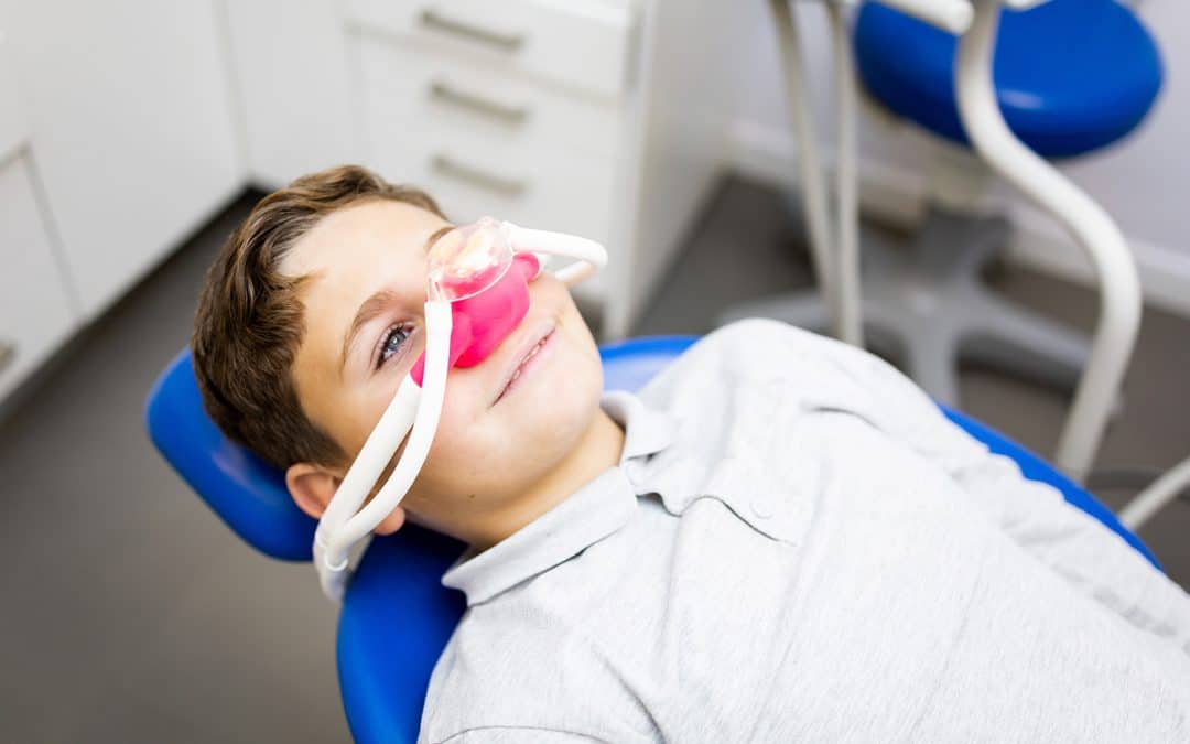 child during pediatric sedation dentist appointment at pediatric dentistry on kimball