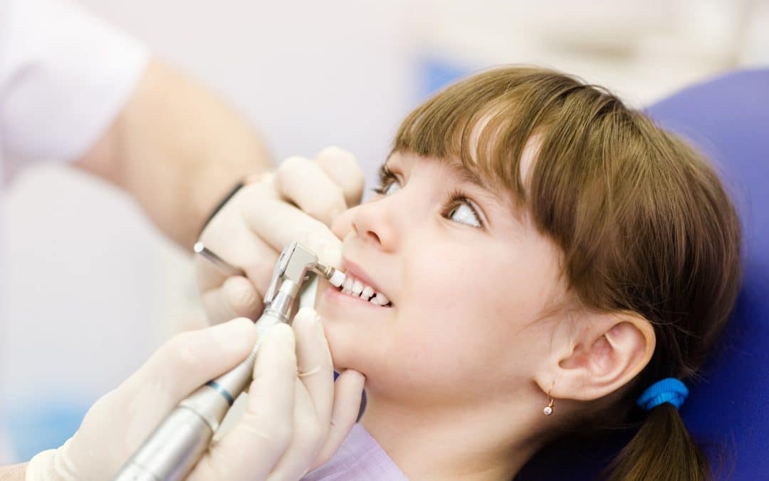 Little girl at the dentist recieving treatment for speach development in Brooklyn NY