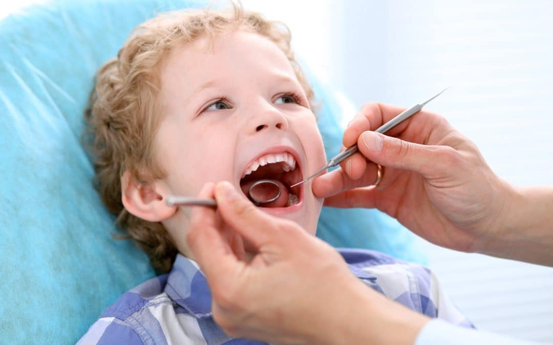 Boy having his first dental procedure with Dr. Vera in Brooklyn NY
