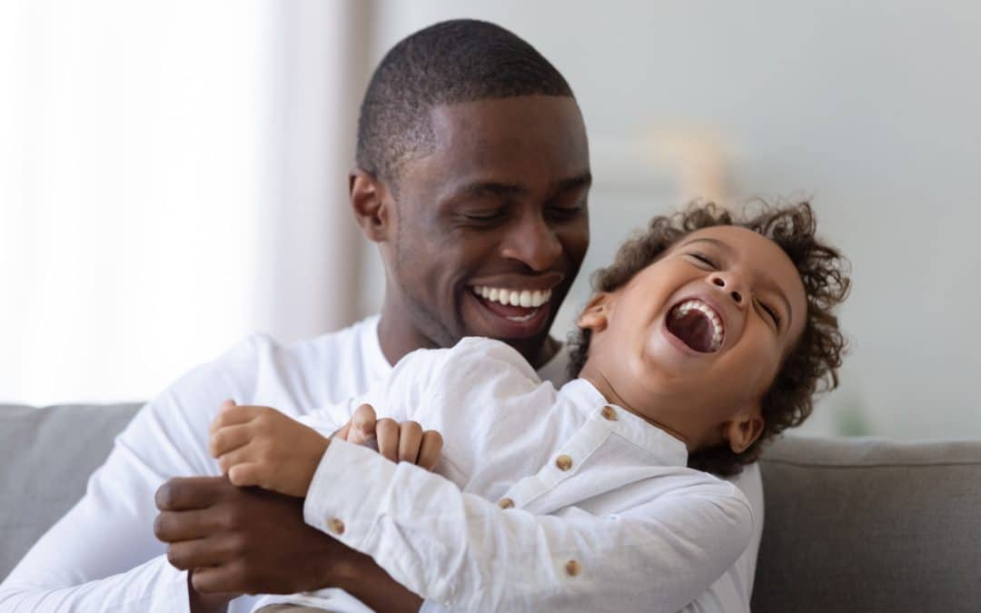 Father and son playing together prepared for their pediatric dental care in Brookyln NY