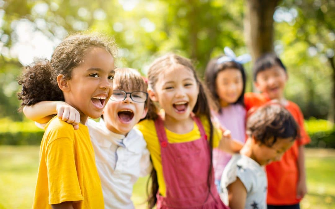 Kids with happy teeth because their parents learned about how to reduce pediatric dental costs with Pediatric Dentistry on Kimball